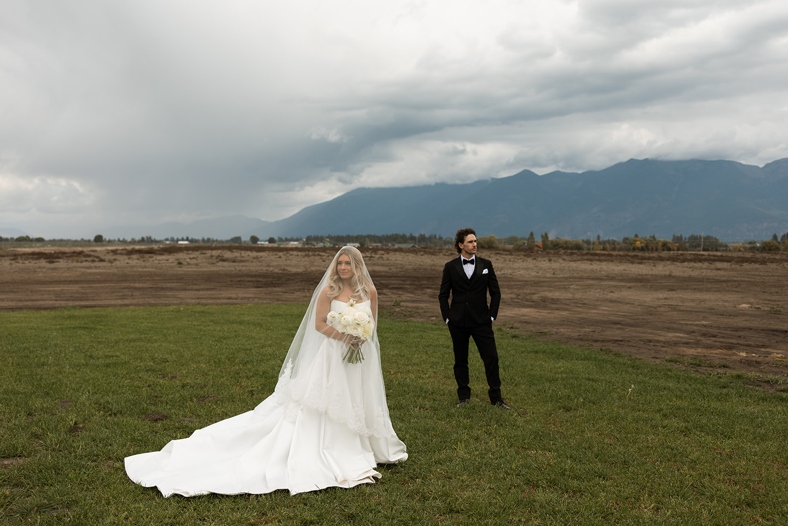 Bride and groom sharing a quiet moment surrounded by Montana mountain views.