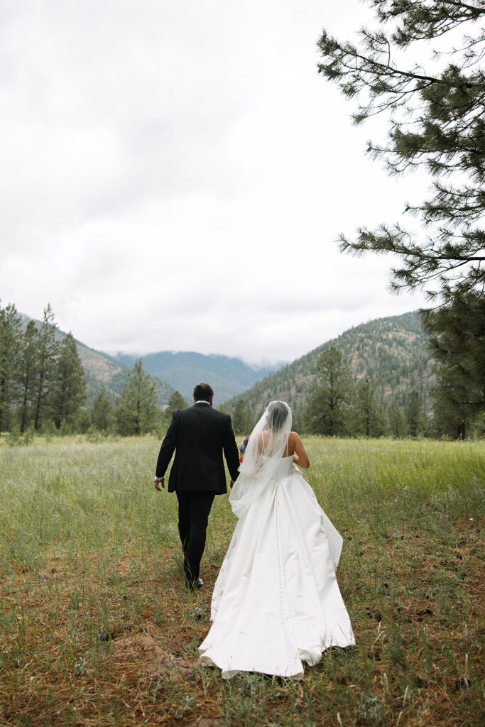 Bride and groom sharing a moment surrounded by Montana’s mountain scenery | planning a montana wedding