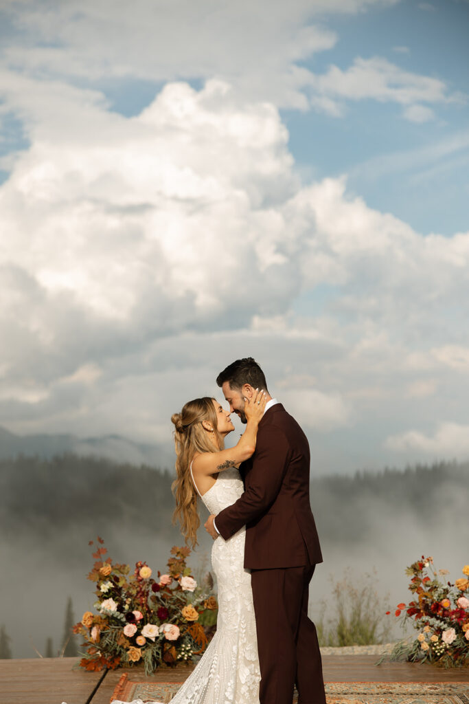 Bride and groom sharing a moment surrounded by Montana’s mountain scenery | planning a montana wedding