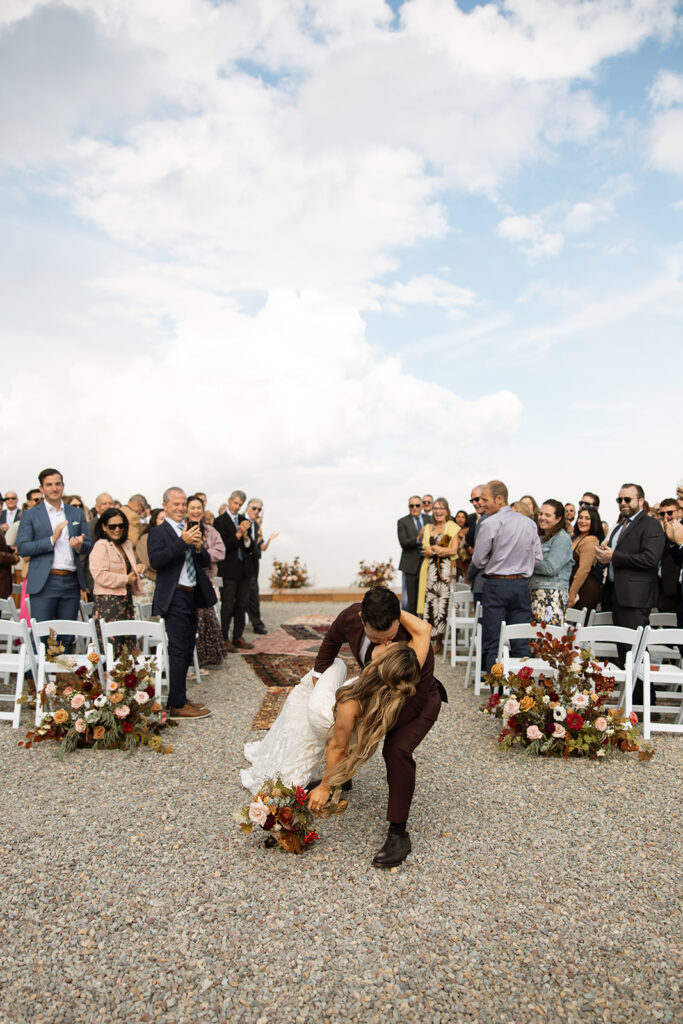 Bride and groom sharing a moment surrounded by Montana’s mountain scenery | planning a montana wedding