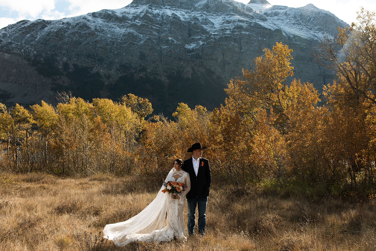 Couple standing together during their Sun Point elopement in Glacier National Park.