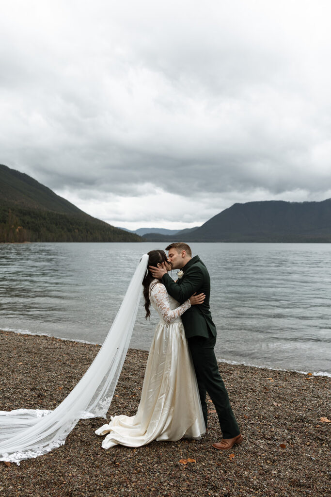 Couple eloping in Glacier National Park with mountain views in the background
