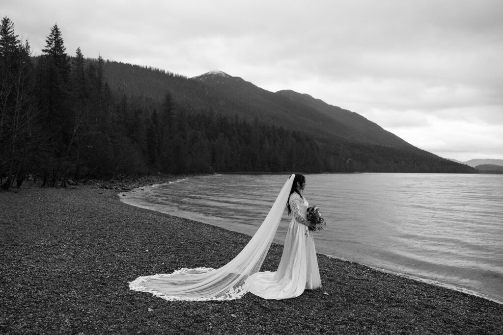 Couple eloping in Glacier National Park with mountain views in the background
