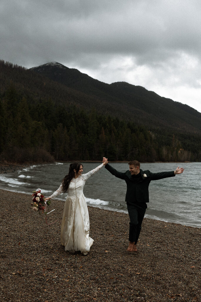 Adventurous couple celebrating their elopement in Glacier National Park surrounded by nature
