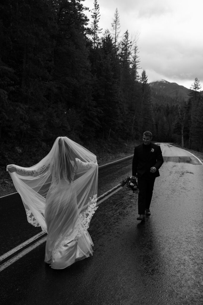 Couple eloping in Glacier National Park with mountain views in the background
