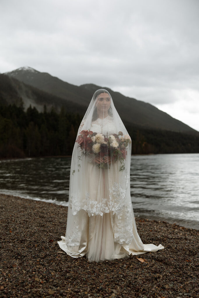 Adventurous couple celebrating their elopement in Glacier National Park surrounded by nature
