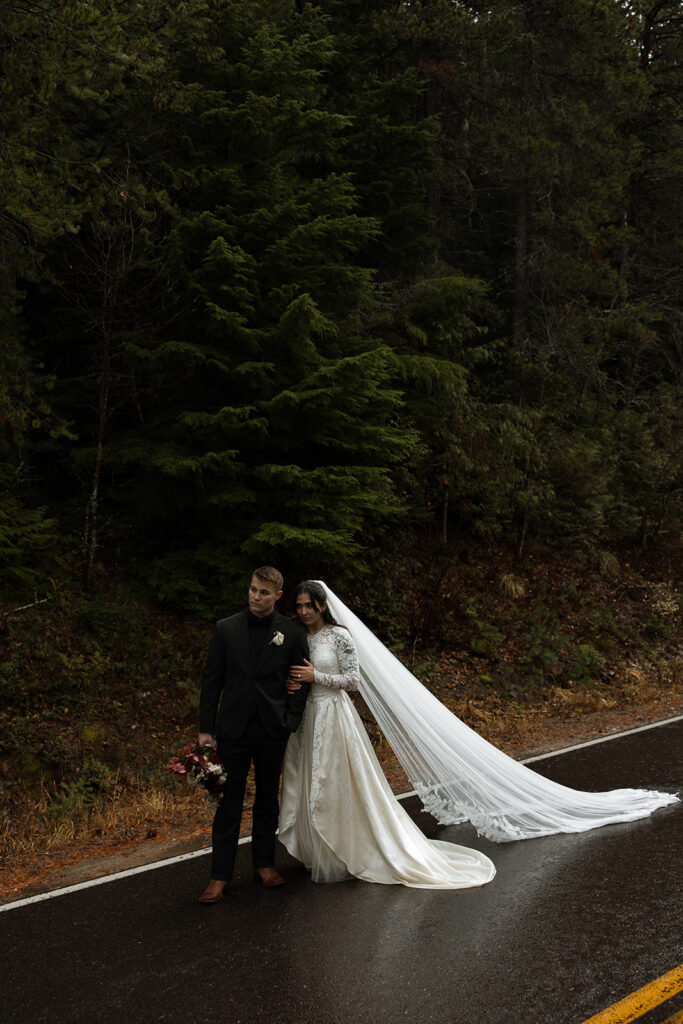 Adventurous couple celebrating their elopement in Glacier National Park surrounded by nature