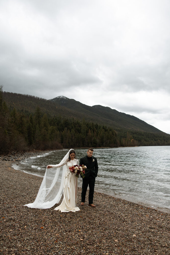 Intimate elopement ceremony by an alpine lake in Glacier National Park
