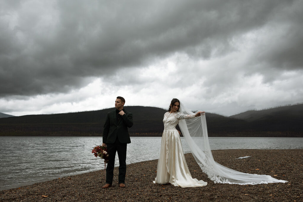 Couple eloping in Glacier National Park with mountain views in the background