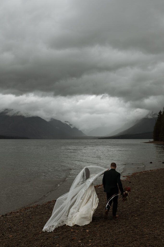 Intimate elopement ceremony by an alpine lake in Glacier National Park
