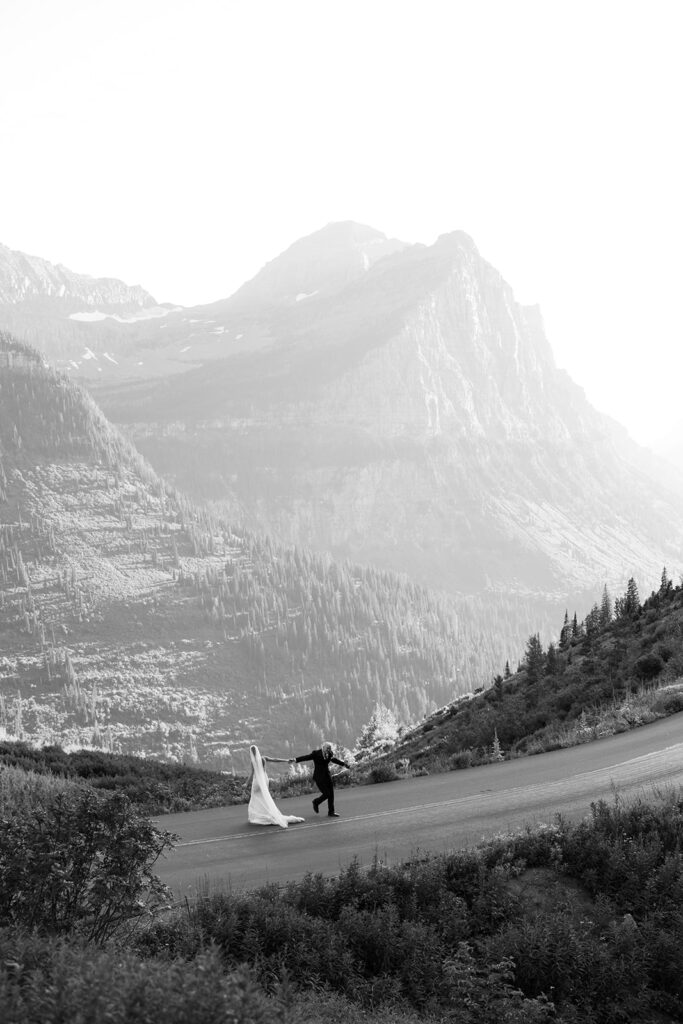 Bride and groom sharing a quiet moment on a Glacier National Park trail
