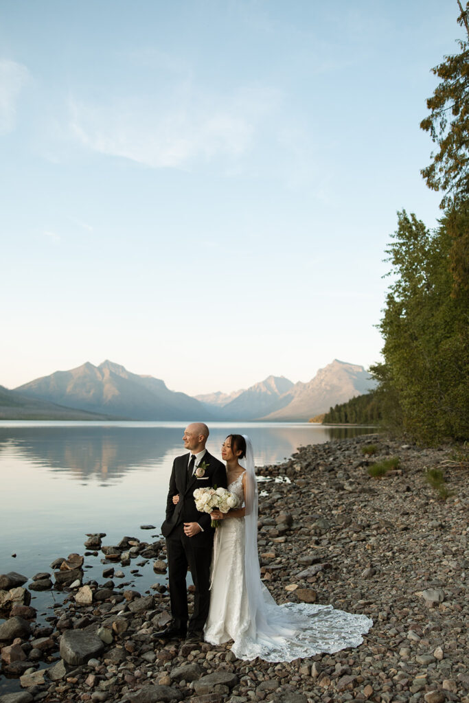 Couple eloping in Glacier National Park with mountain views, captured by a Montana photographer during a calm, intimate ceremony.