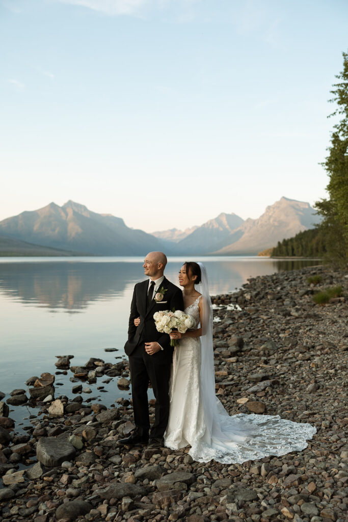 Couple eloping in Glacier National Park with mountain views, captured by a Montana photographer during a calm, intimate ceremony.
