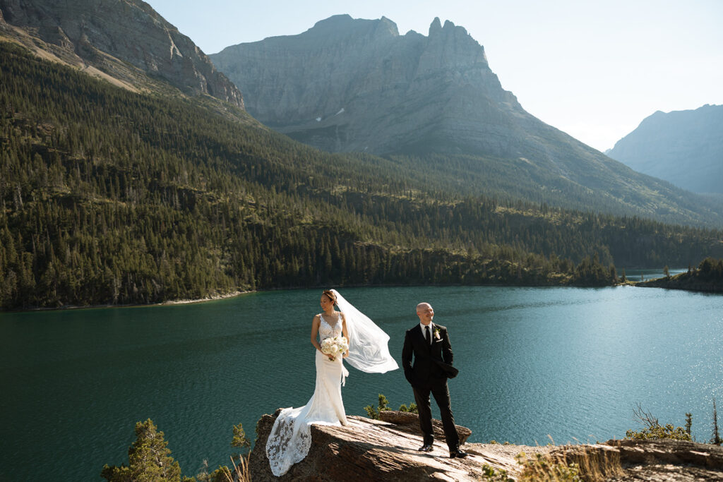 Couple eloping in Glacier National Park with mountain views, captured by a Montana photographer during a calm, intimate ceremony.