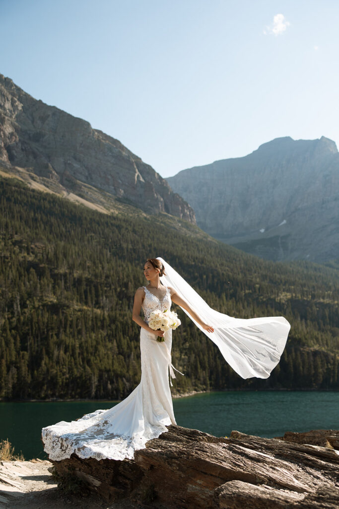 Couple eloping in Glacier National Park with mountain views, captured by a Montana photographer during a calm, intimate ceremony.
