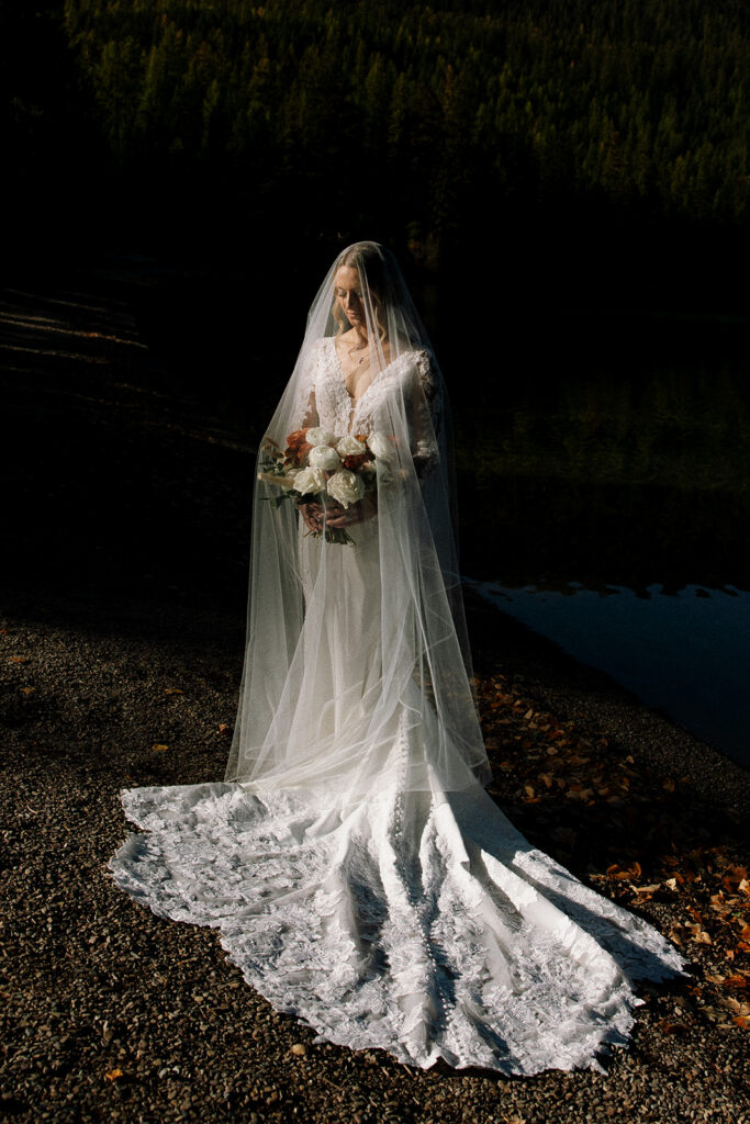 Newlyweds sharing a quiet moment together in nature after their ceremony.