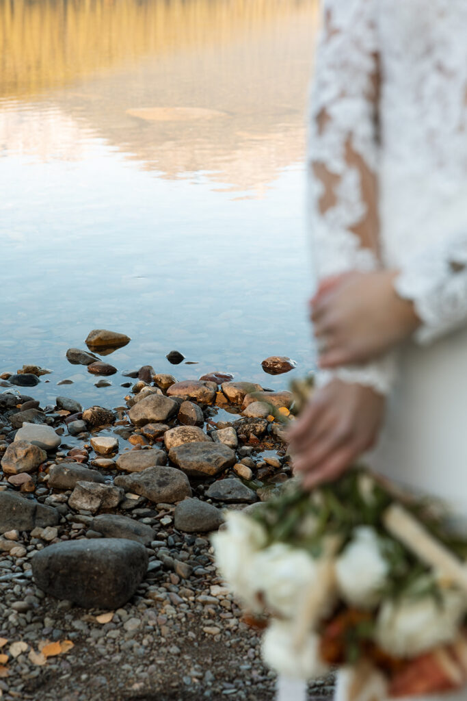 Couple celebrating outdoors in a scenic mountain landscape during an intimate elopement.