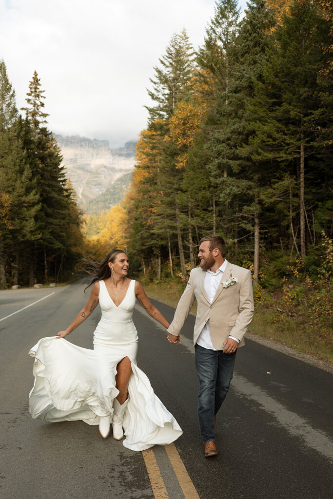Romantic sunset portrait of a married couple embracing in a natural landscape.