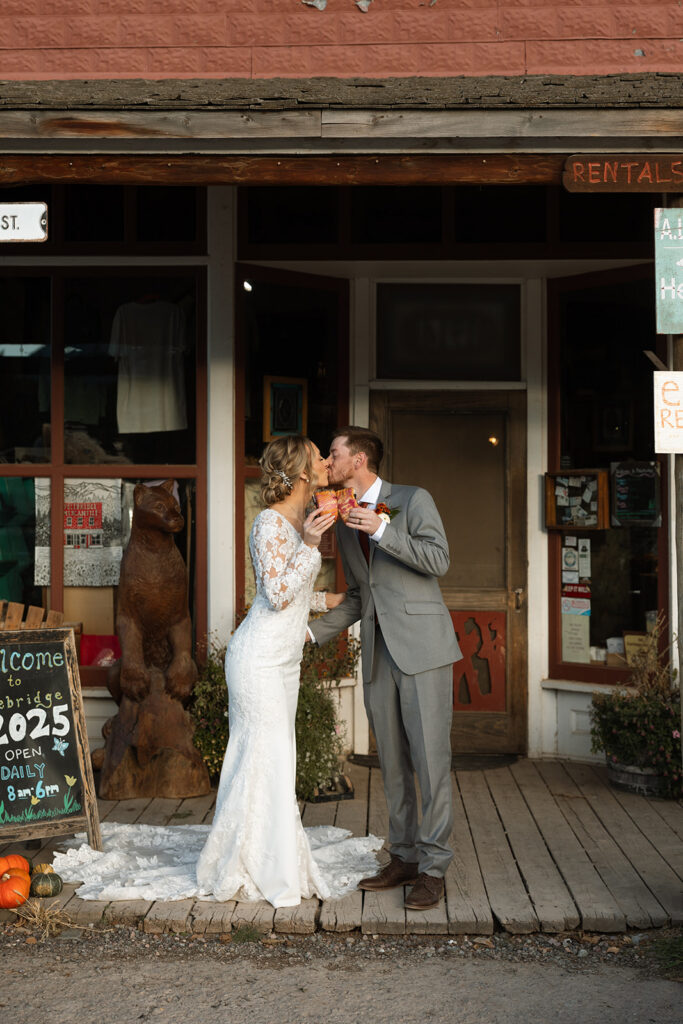 Romantic sunset portrait of a married couple embracing in a natural landscape.