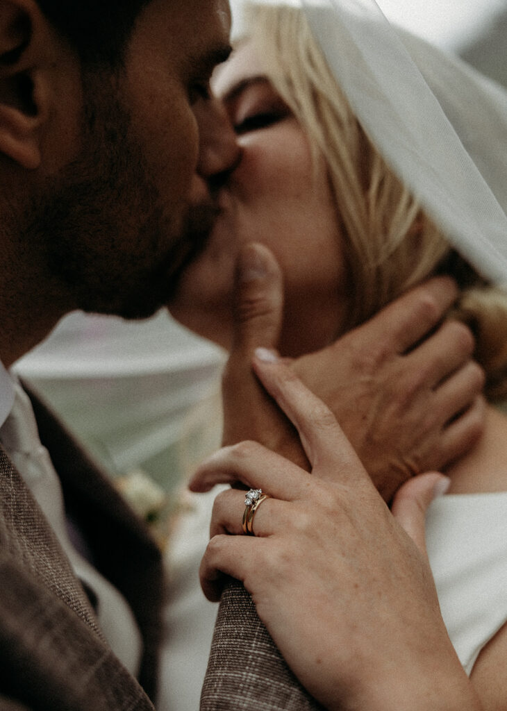Couple standing together in Glacier National Park during their intimate mountain elopement.