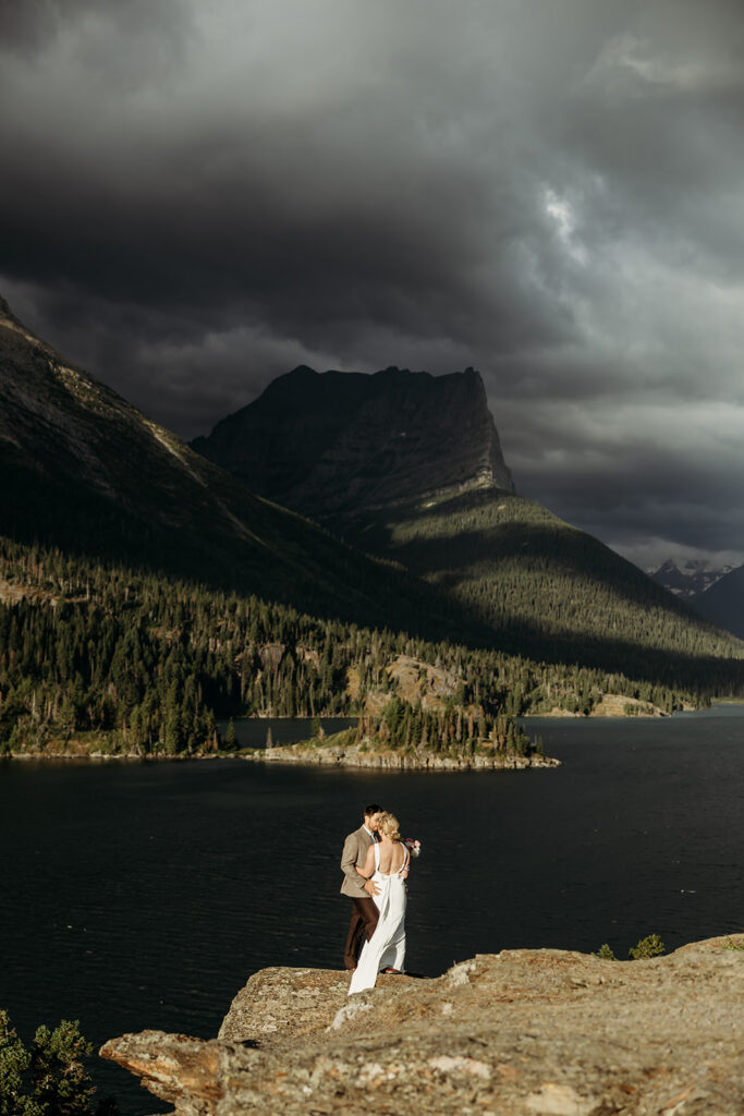 Adventure elopement moment in Glacier National Park at sunrise
