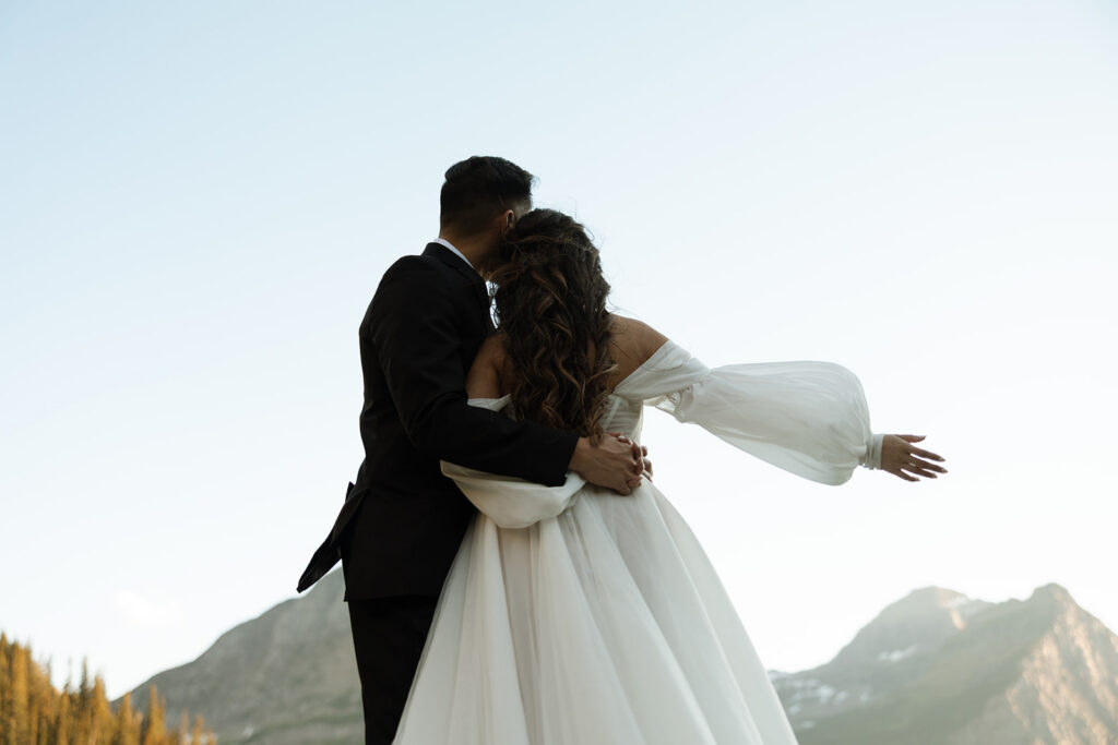 Bride and groom walking together after a sunrise elopement ceremony