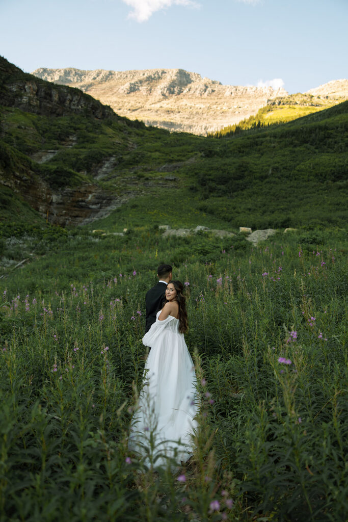 Couple sharing a quiet moment during a sunrise elopement in the mountains