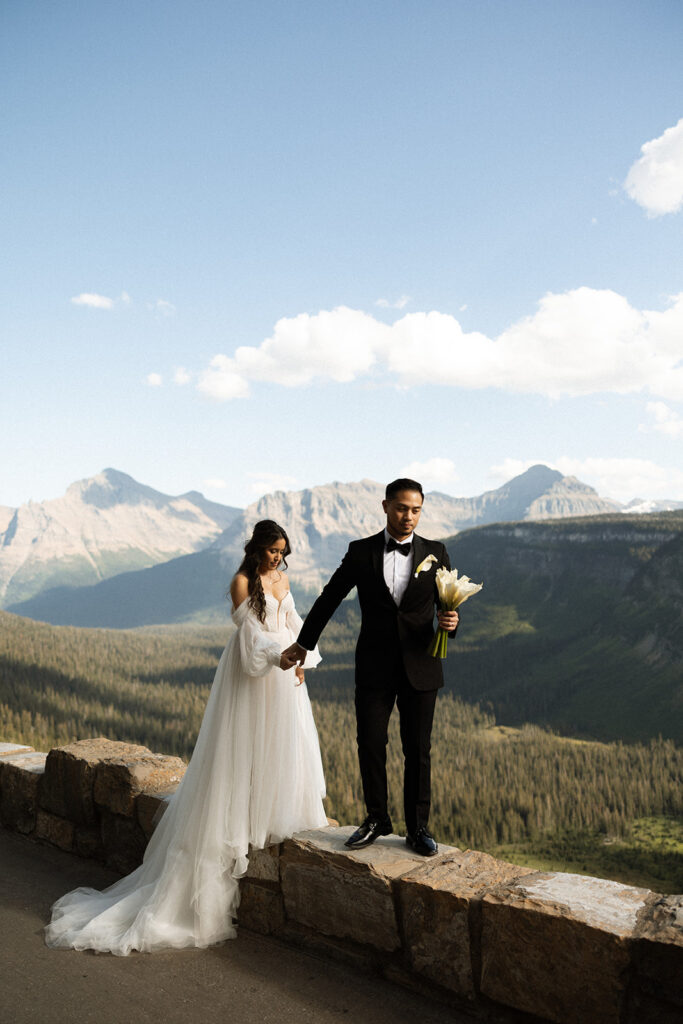Newly married couple celebrating during an intimate sunrise elopement
