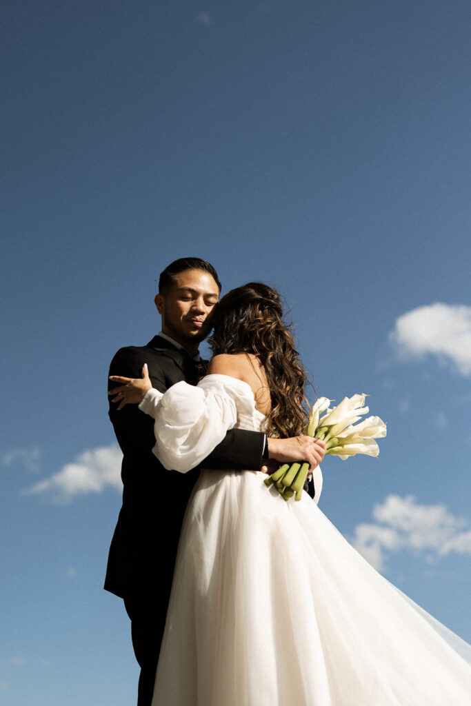 Romantic sunrise elopement ceremony with mountain views and soft morning light
