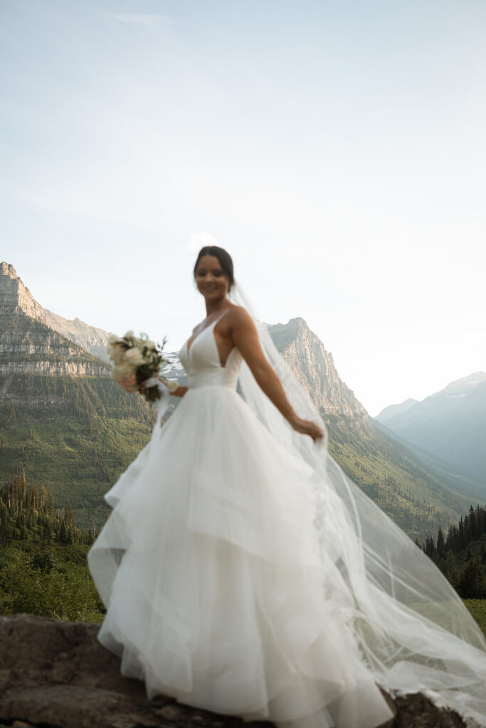 Scenic overlook with lake and mountains during sun point elopement