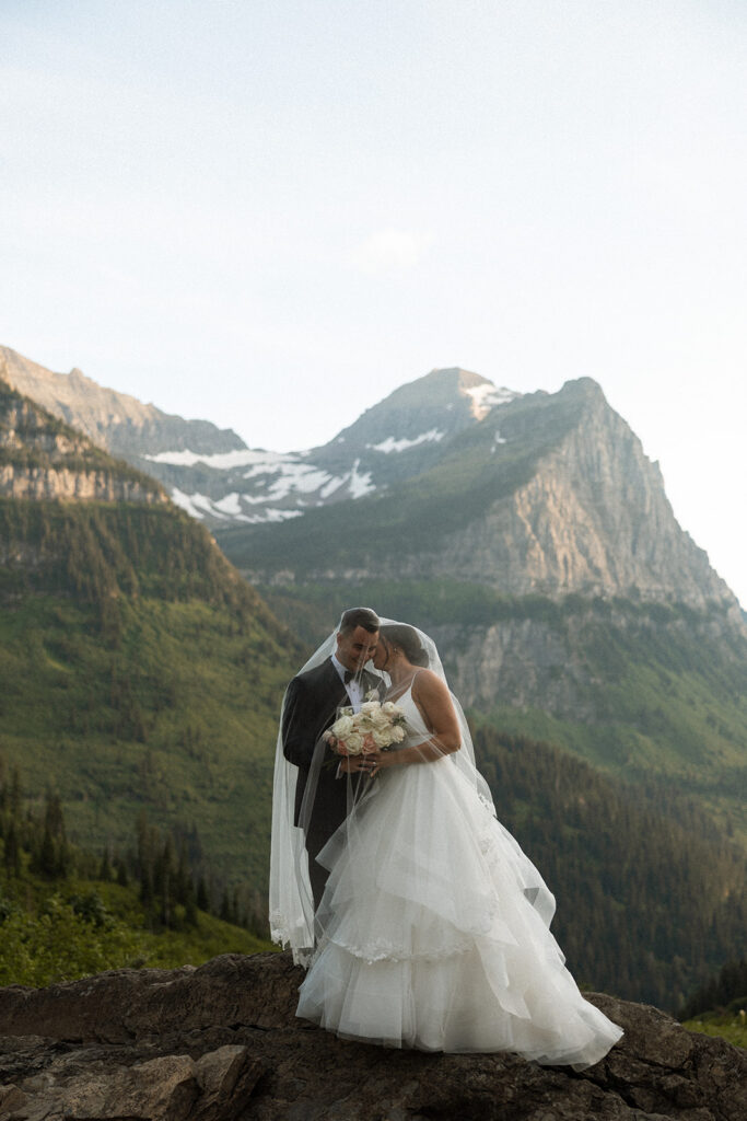 Sun Point Elopement in Glacier National Park with mountain views
