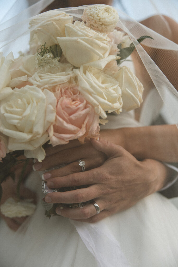 Couple embracing with expansive alpine landscape in the background | sun point elopement
