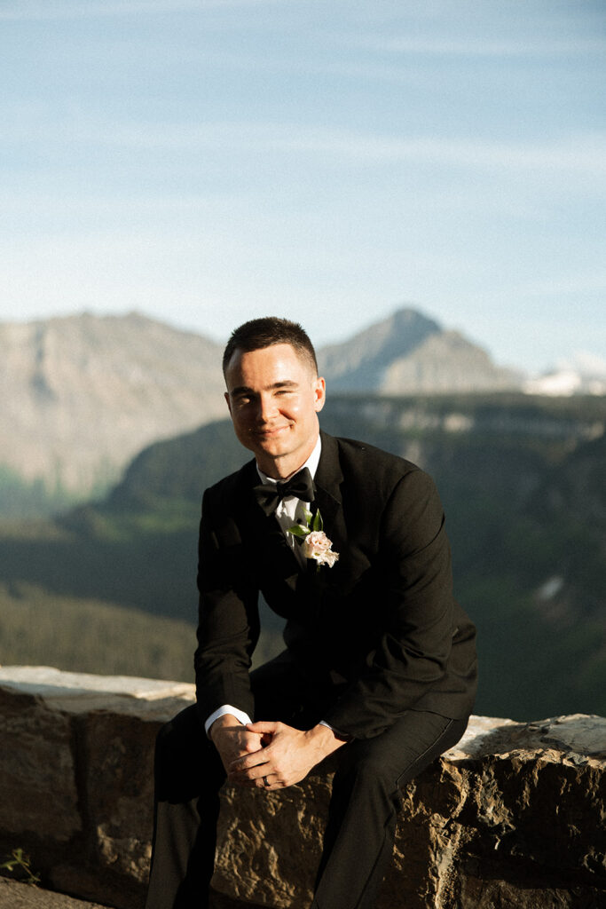 Scenic overlook with lake and mountains during sun point elopement