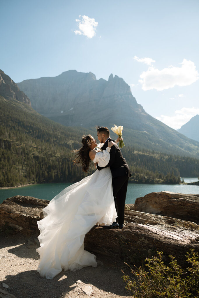 Newly married couple celebrating during an intimate sunrise elopement