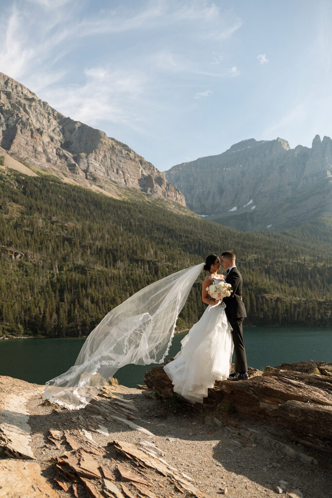 Scenic overlook with lake and mountains during sun point elopement