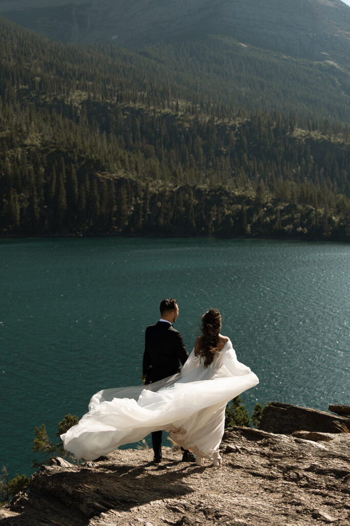 Couple sharing a quiet moment during a sunrise elopement in the mountains