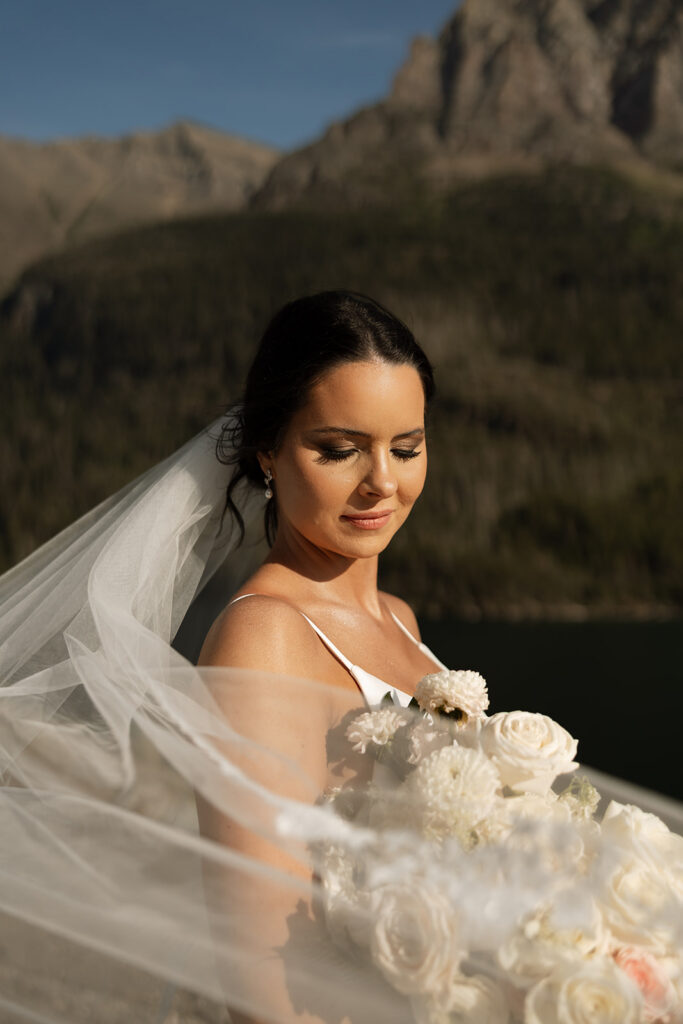 Scenic overlook with lake and mountains during sun point elopement