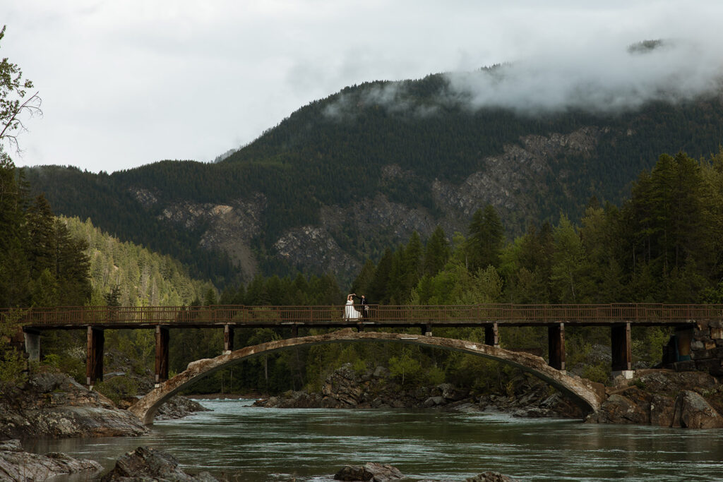 Bride and groom exploring Glacier National Park during their intimate wedding day
