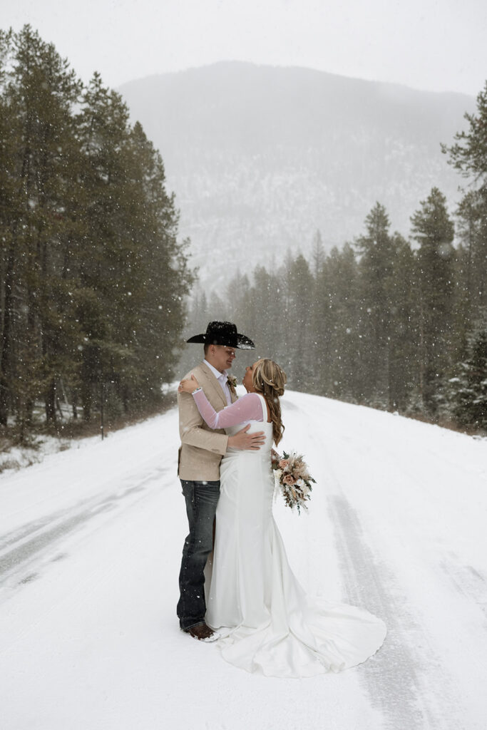 Eloping couple exploring Glacier National Park during an adventurous wedding day
