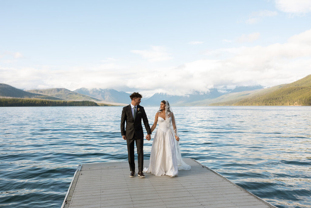 Newly married couple celebrating their Glacier National Park elopement in a beautiful natural landscape.